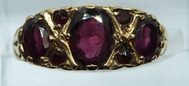 A 9ct ring set with garnets, 3.4g, size N