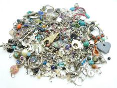 A large collection of silver earrings including abalone, pressed amber, hoops etc
