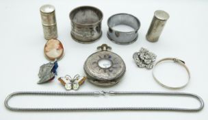 A collection of items including two silver napkin rings, cameo brooch, silver butterfly brooch set