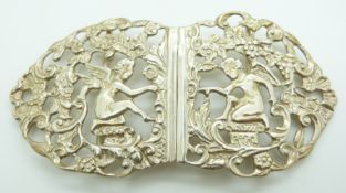 Hallmarked silver belt buckle depicting winged cherubs, London 1995 maker's mark indistinct,