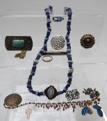 A collection of jewellery including beads, glass necklace, brooches including Victorian, Miracle,
