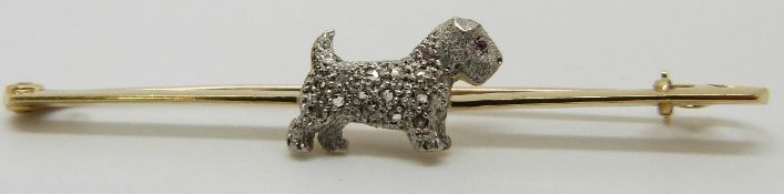 A 15ct gold brooch set with a diamond encrusted platinum dog, in original box