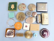 A collection of compacts including Stratton, Vogue, Art Deco etc and a small silver lidded blue