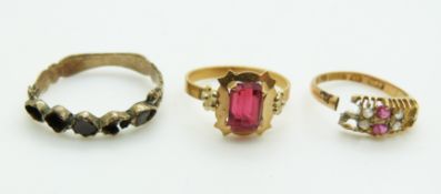 An 18ct gold ring (1.5g), a 15ct gold ring (1.1g) and a Victorian ring