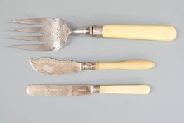 Two hallmarked silver bladed knives and a hallmarked silver tined fish serving fork, Sheffield 1882,