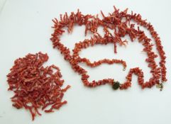 A large coral necklace made up of natural strands