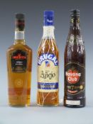 Three bottles of golden rum comprising Brugal Ron Anejo, 700ml, 38% vol, in original netting,