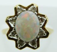 An 18ct gold ring set with an opal and diamonds, 4.3g, size I