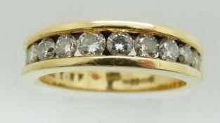 An 18ct gold half eternity ring set with twelve round brilliant cut diamonds, approximately 1ct