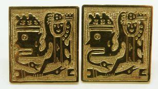 A pair of 18ct gold cufflinks with stylised figural decoration, impressed 750 verso, 12.8g
