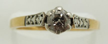 An 18ct gold ring set with a a diamond in a platinum setting, 2.7g, size L/M