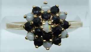 A 9ct gold ring set with sapphires and opals in the cluster, 2.9g, size O/P