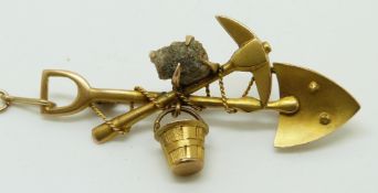 Victorian 9ct gold miner's brooch depicting a shovel, pick, bucket and mineral sample, 4.1cm, 2.9g