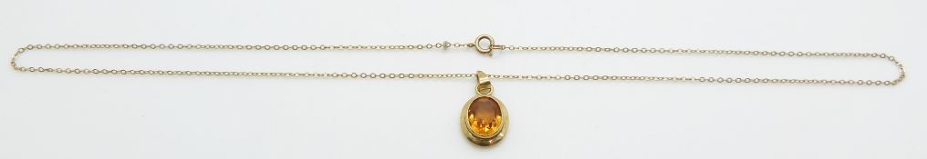 A 9ct gold pendant set with citrine on 9ct gold chain, 2.6g