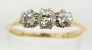 An 18ct gold ring set with three diamonds in Maurice Moses Diamond Merchants, Oxford Street