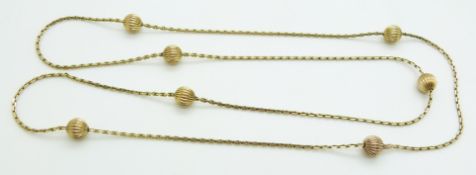 A yellow metal necklace with sphere decoration, 17.3g