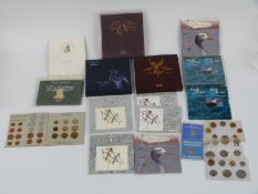 A collection of South African and other proof and brilliant uncirculated coin sets, includes some