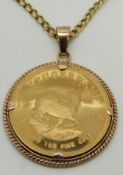 A 9ct gold pendant set with a 1984 1oz fine gold Krugerrand, on 9ct gold chain, 48.1g