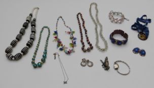 A collection of jewellery including glass beaded necklaces, Jewelcraft bracelet, vintage necklaces