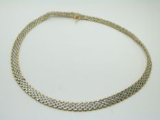 A 9ct gold bi-coloured necklace made up of rectangular links, 29.6g