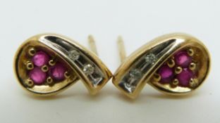 A pair of 9ct gold earrings set with rubies and diamonds, 2g