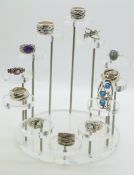 Twelve silver rings including amethyst, labadorite and synthetic opal, on perspex stand