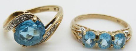 Two 9ct gold rings set with blue topaz and diamonds, 4.5g