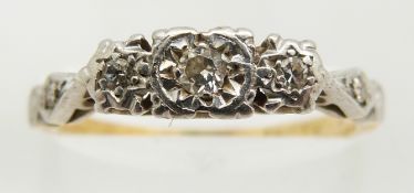 An 18ct gold ring set with diamonds in a platinum setting, 2.2g, size L