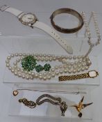 A collection of jewellery including rolled gold locket, silver bangle, brooches, Accurist watch,