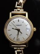 Tissot Seastar ladies wristwatch with date aperture, gold hands and baton markers and silver dial,