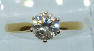 An 18ct gold ring set with a round brilliant cut diamond of approximately 1ct, 3.3g, size M