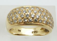 An 18ct gold ring set with four rows of diamonds, 5.6g, size L