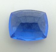 A loose cushion cut sapphire measuring approximately 7.6ct