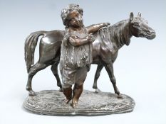 19thC bronzed figure of a girl with horse on naturalistic base, H14.5cm