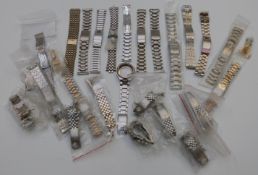 Twenty-three wristwatch bracelets including Seiko, Tissot and Oris.