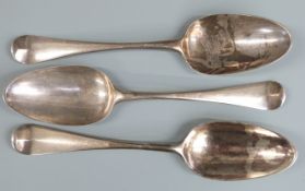 Three Georgian bottom hallmarked silver table spoons, comprising a pair London 1762 maker's mark WT,