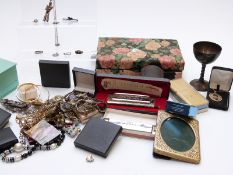 A collection of costume jewellery including silver rings, silver pendant in the form of Elvis,