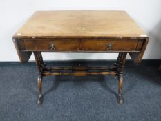 An antique walnut sofa table CONDITION REPORT: Veneer lifting and numerous minor