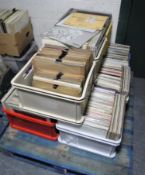 A pallet containing nine plastic crates of vinyl LP's and 78's,