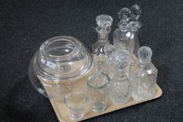 A tray of six continental glass decanters with stoppers together with two graduated glass bowls and