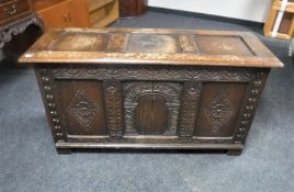 An early 20th century carved oak blanket box