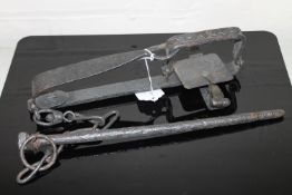 A cast iron animal trap