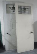 Two 20th century doors with stained glass panel
