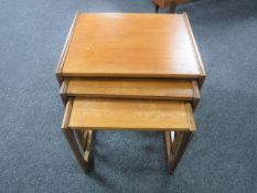 A nest of three teak G Plan tables