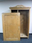 An antique pine hall wardrobe