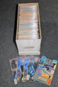 A box containing 21st century DC comics including Batman,