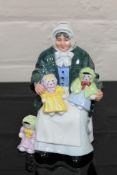 A Royal Doulton china figurine : The Rag Doll Seller, HN 2944, height 18 cm.
