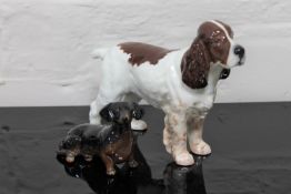 Two Beswick china figurines : Cocker Spaniel (a/f), model 967, gloss, liver and white, height 15 cm,
