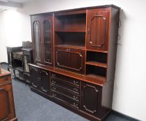 A mahogany bureau display wall unit