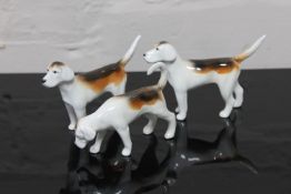 Three Beswick china figurines : Foxhounds, models 942, 942 and 943, gloss.